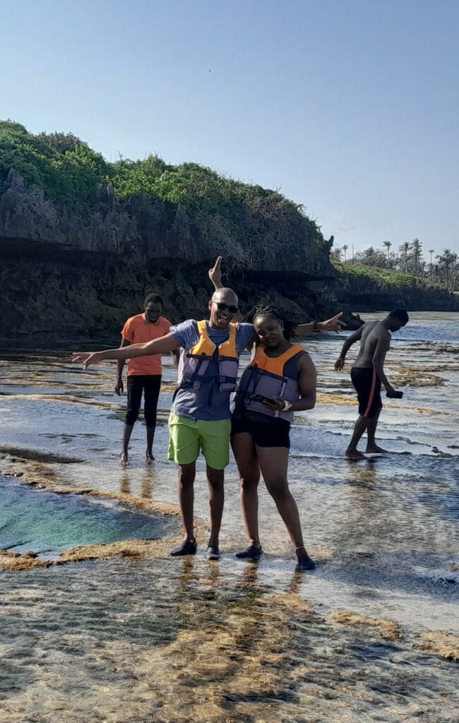 happy guests exploring the map of africa pool in Tiwi